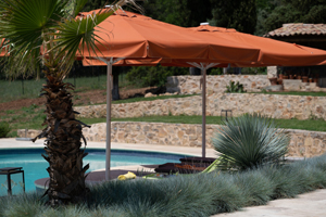 Heated private pool with sun loungers and covered lounge area at Mas de l’Aven in Lorgues, Provence.
